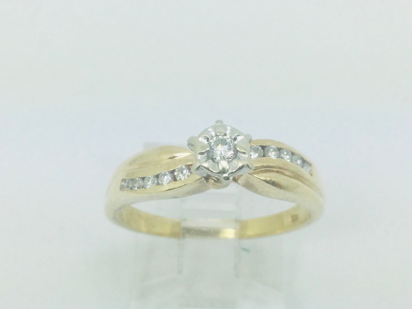 10k Yellow Gold Round Cut 0.16ct Diamond Illusion and Channel Set Ring