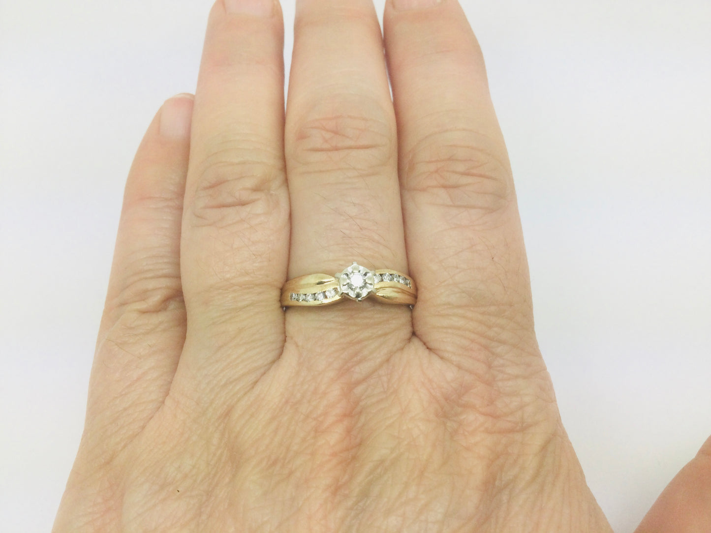 10k Yellow Gold Round Cut 0.16ct Diamond Illusion and Channel Set Ring