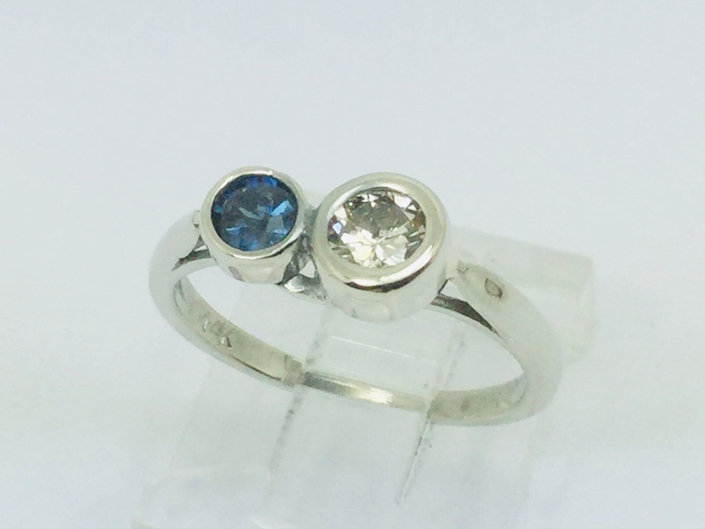 14k White Gold Round Cut 25pt Diamond & 16pt Sapphire Ring