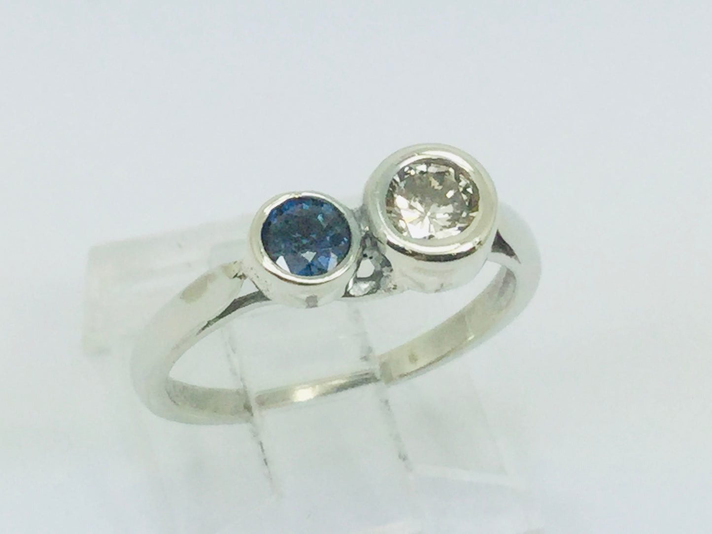 14k White Gold Round Cut 25pt Diamond & 16pt Sapphire Ring