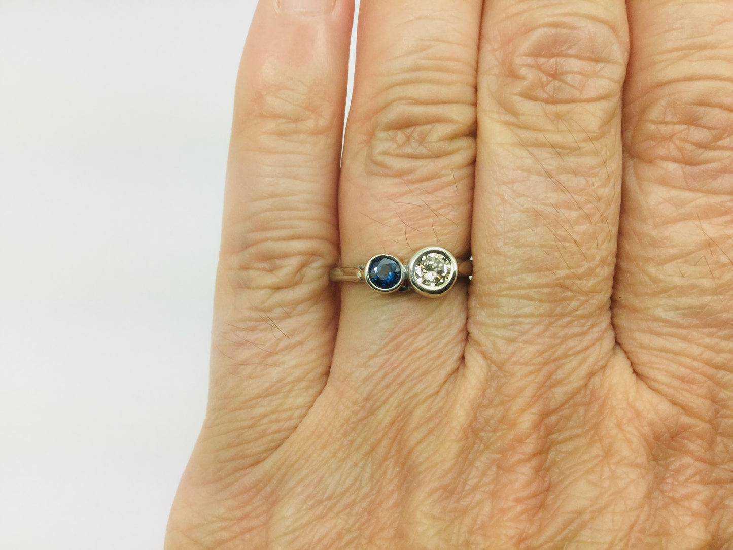 14k White Gold Round Cut 25pt Diamond & 16pt Sapphire Ring