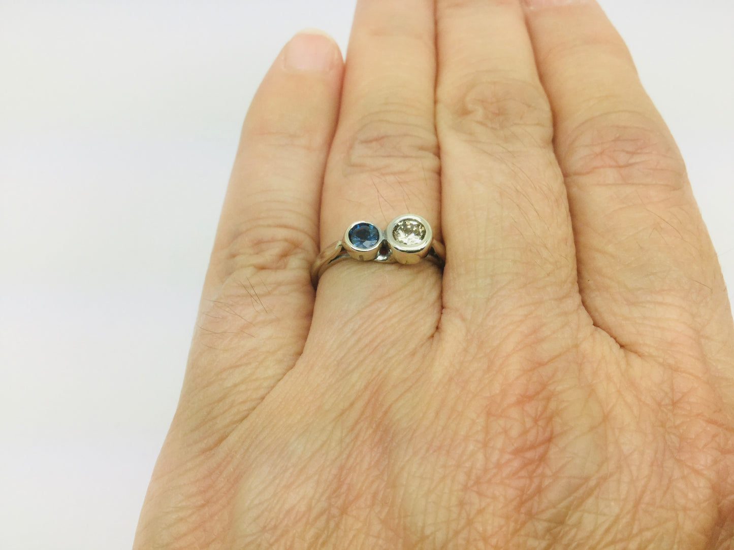 14k White Gold Round Cut 25pt Diamond & 16pt Sapphire Ring