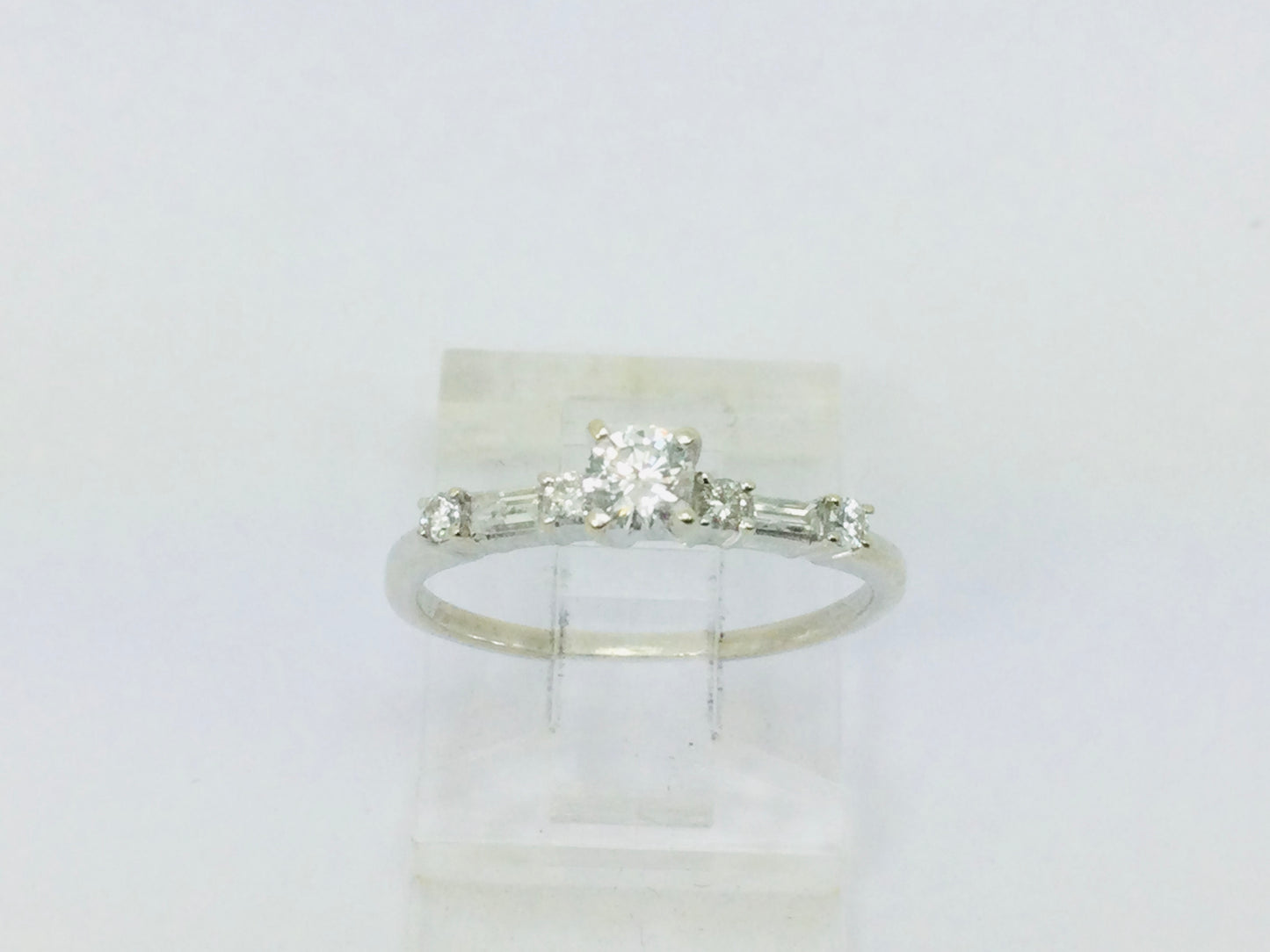 14k White Gold Round Cut 23pt Diamond with Round and Baguette Diamond Accents Ring