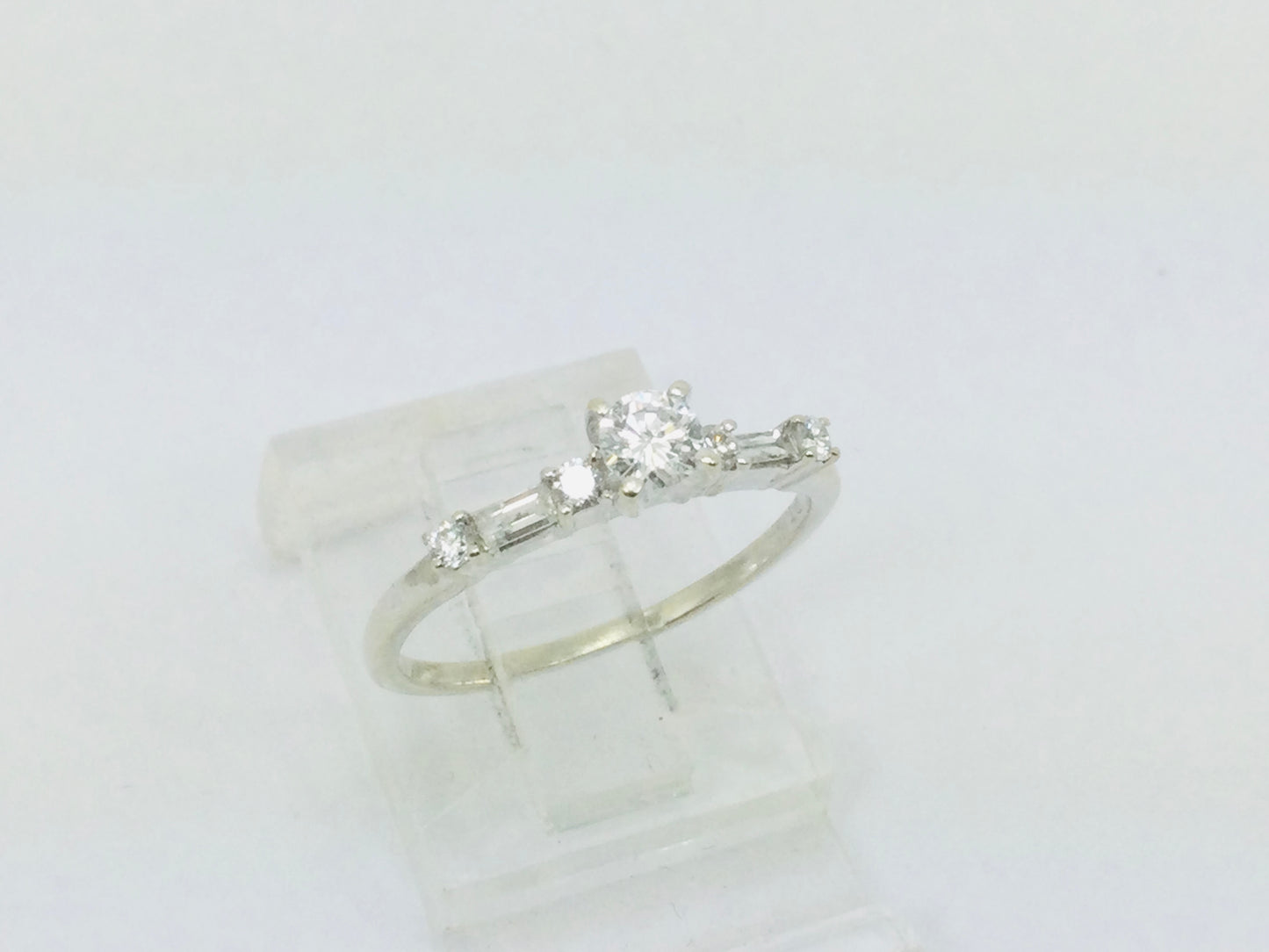 14k White Gold Round Cut 23pt Diamond with Round and Baguette Diamond Accents Ring