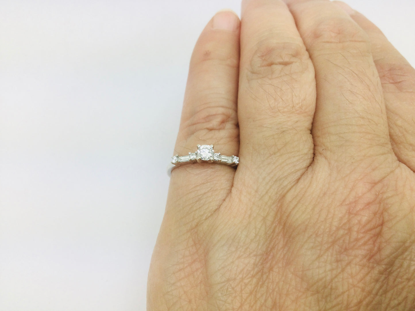 14k White Gold Round Cut 23pt Diamond with Round and Baguette Diamond Accents Ring