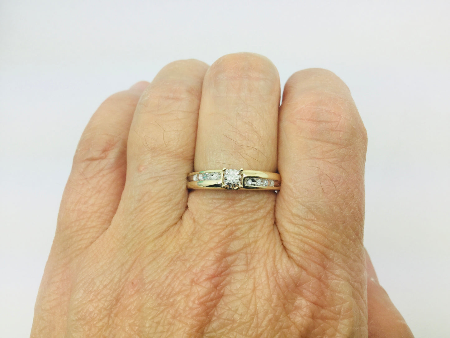 10k Yellow Gold Round Cut 7.5pt Diamond Solitaire with Accents Ring