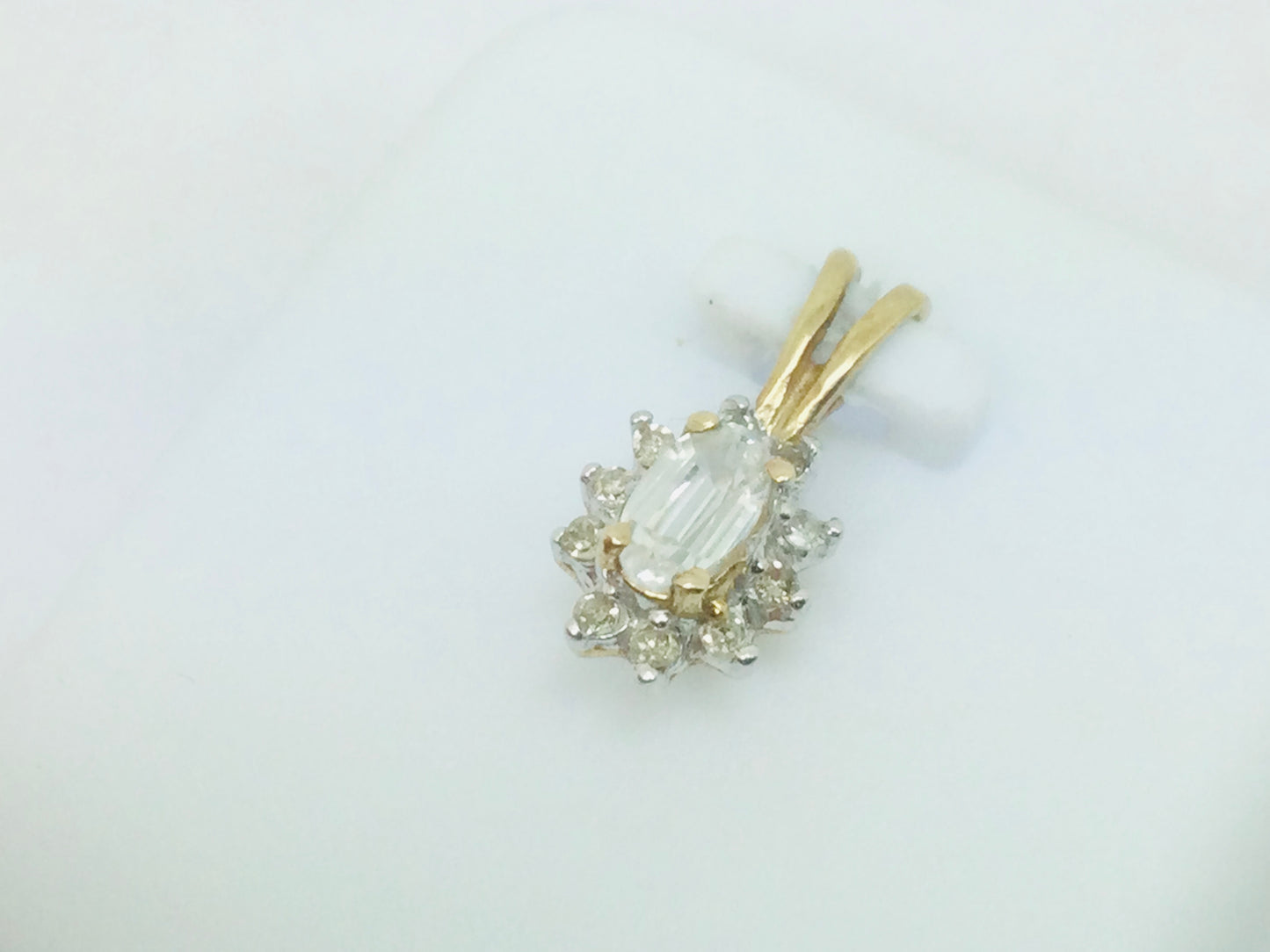 10k Yellow Gold Oval Cut 25pt Topaz & 10pt Diamond Halo Pendent
