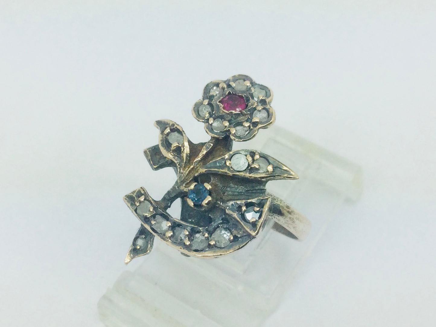 10k Yellow Gold Round Cut 22pt Diamond, 5pt Ruby, and 5pt Blue Topaz Flower Ring