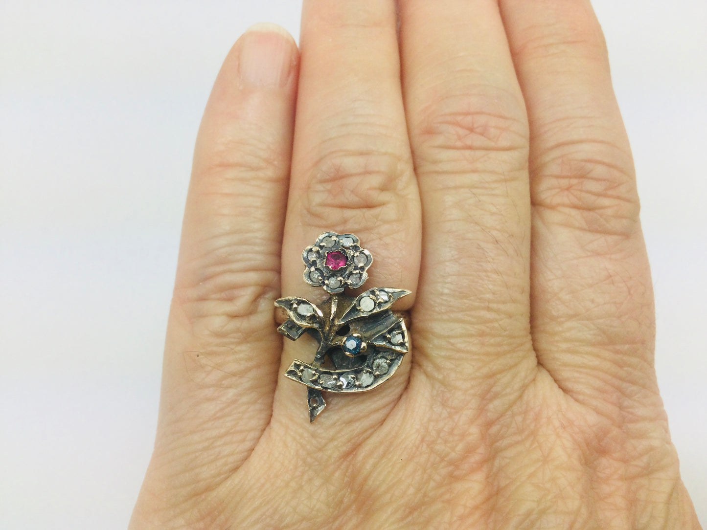 10k Yellow Gold Round Cut 22pt Diamond, 5pt Ruby, and 5pt Blue Topaz Flower Ring