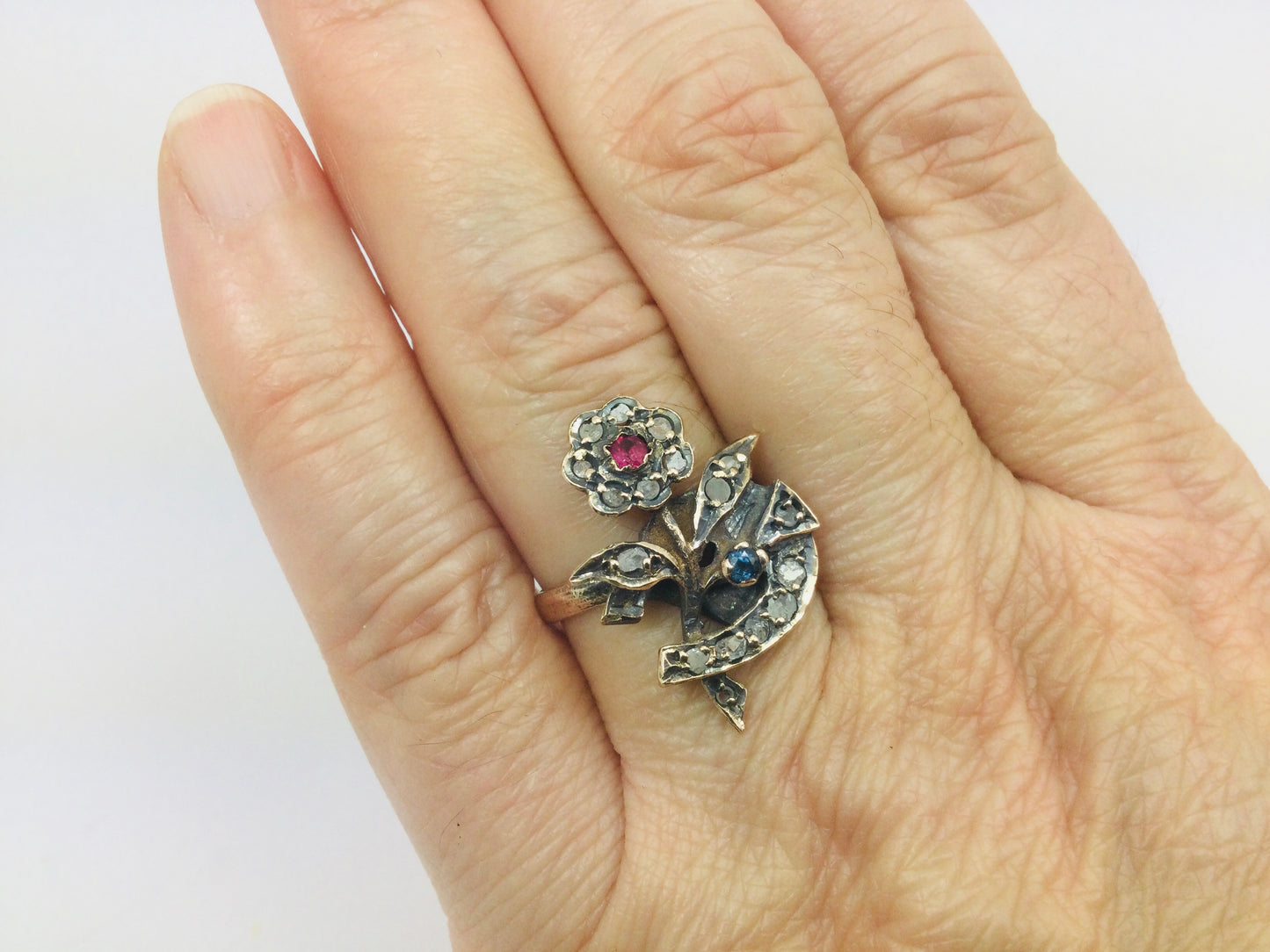 10k Yellow Gold Round Cut 22pt Diamond, 5pt Ruby, and 5pt Blue Topaz Flower Ring