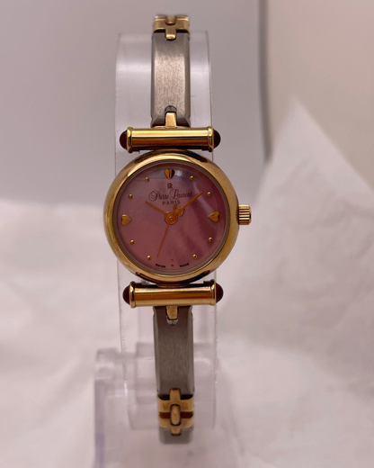 Watch with gold and silver band on a white background