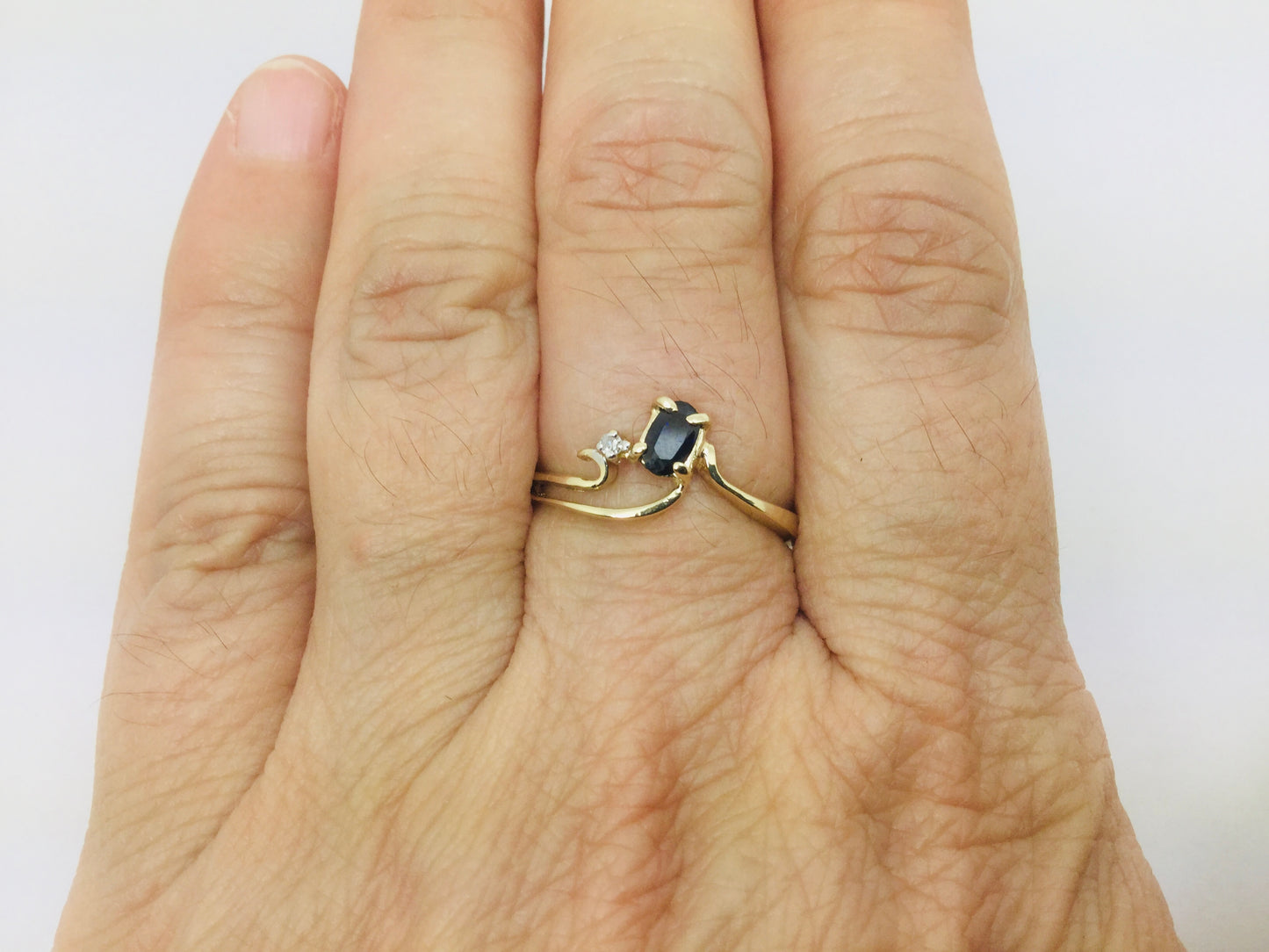 10k Yellow Gold Oval Cut 25pt Sapphire September Birthstone & 2pt Diamond Wave Ring