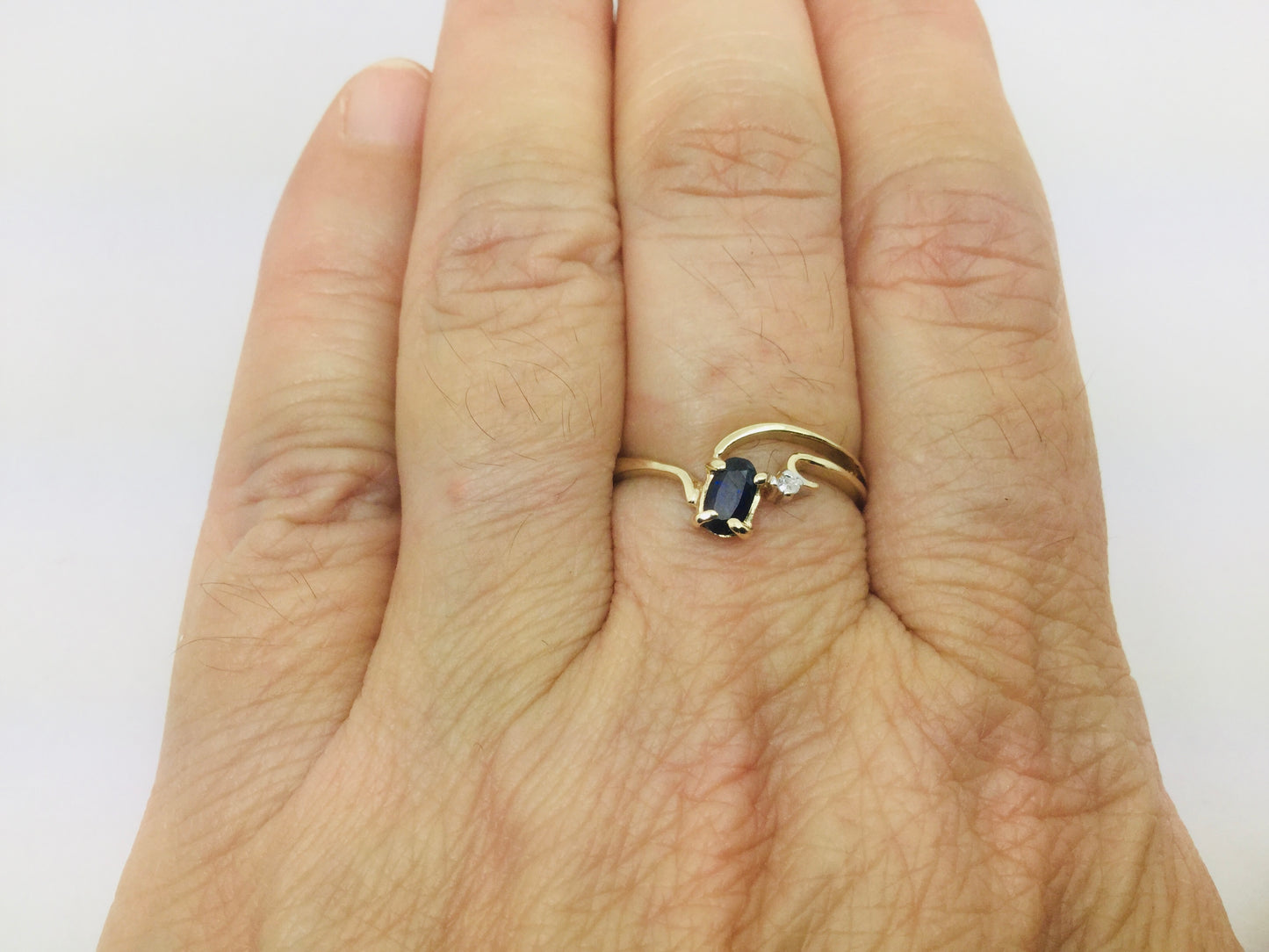 10k Yellow Gold Oval Cut 25pt Sapphire September Birthstone & 2pt Diamond Wave Ring