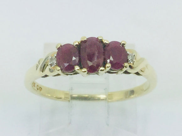 10k Yellow Gold Oval Cut Ruby July Birthstone Trinity & Diamond Ring