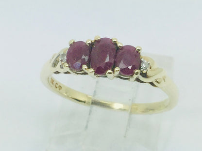 10k Yellow Gold Oval Cut Ruby July Birthstone Trinity & Diamond Ring