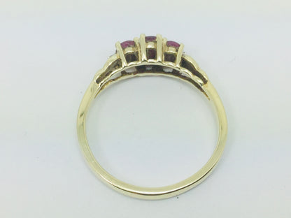 10k Yellow Gold Oval Cut Ruby July Birthstone Trinity & Diamond Ring