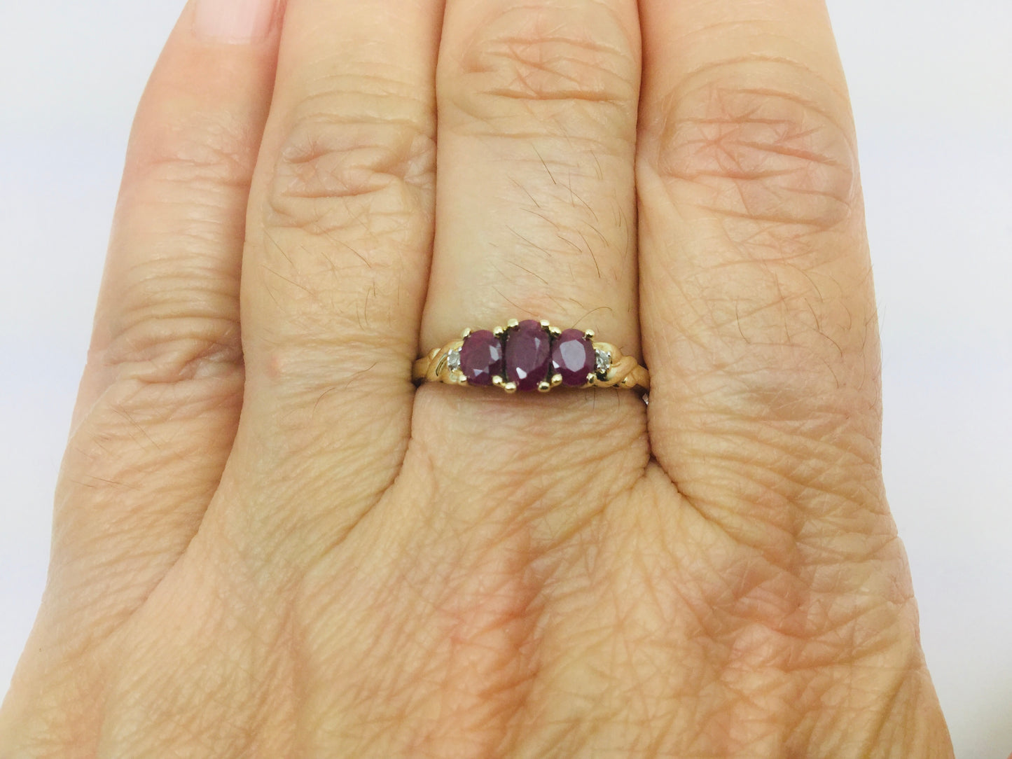 10k Yellow Gold Oval Cut Ruby July Birthstone Trinity & Diamond Ring
