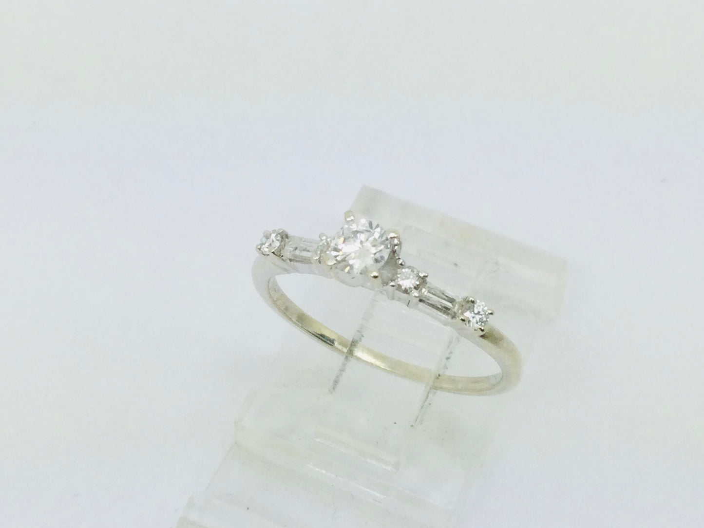 14k White Gold Round Cut 23pt Diamond with Round and Baguette Diamond Accents Ring