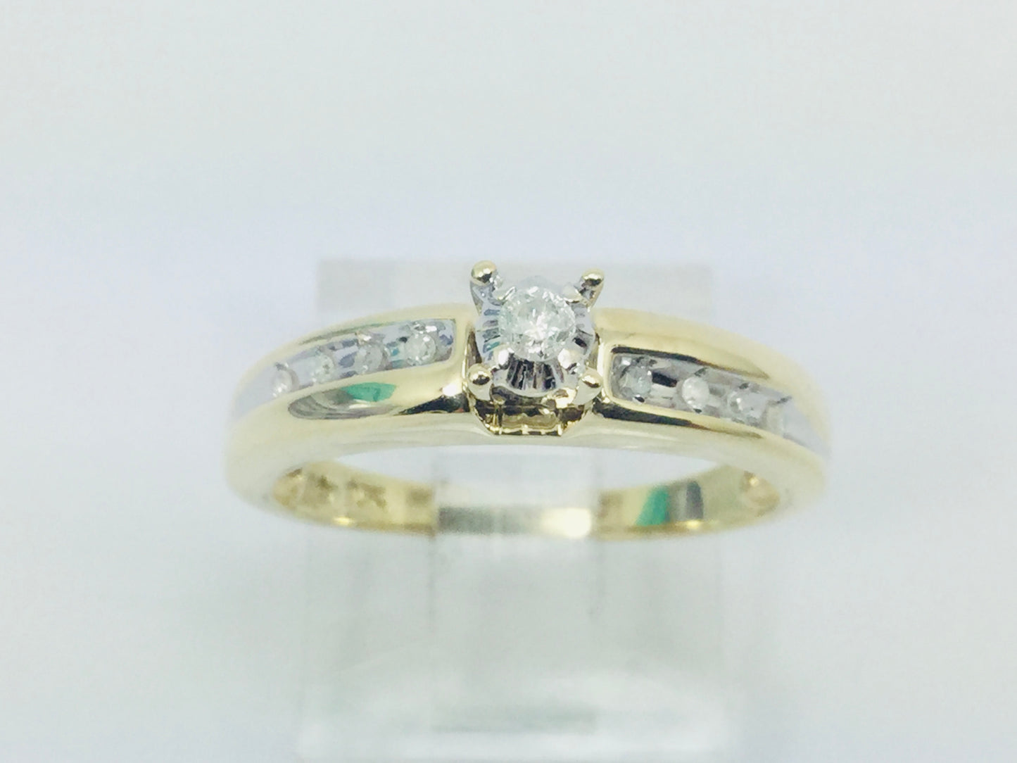 10k Yellow Gold Round Cut 7.5pt Diamond Solitaire with Accents Ring
