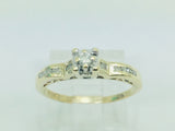 10k Yellow Gold Round Cut 15pt Diamond Illusion Set with Channel Set Accents Ring