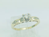 10k Yellow Gold Round Cut 15pt Diamond Illusion Set with Channel Set Accents Ring