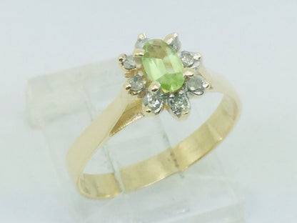 10k Yellow Gold Oval Cut 25pt Peridot August Birthstone & 8pt Diamond Halo Ring