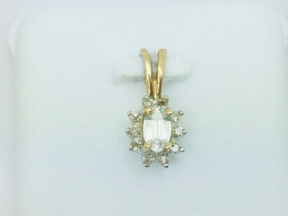 10k Yellow Gold Oval Cut 25pt Topaz & 10pt Diamond Halo Pendent