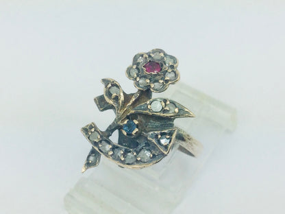 10k Yellow Gold Round Cut 22pt Diamond, 5pt Ruby, and 5pt Blue Topaz Flower Ring