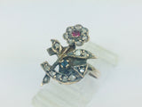10k Yellow Gold Round Cut 22pt Diamond, 5pt Ruby, and 5pt Blue Topaz Flower Ring
